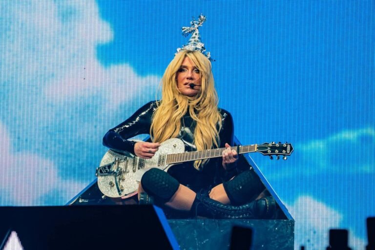 Kesha Fights Back Tears While Performing Emotional Rendition of ‘Happy’ at Ohio Concert By [Your Name], July 30, 2025 Pop star Kesha delivered an emotionally raw and unforgettable performance at her Ohio tour stop on Monday night, where she broke down in tears while singing her song “Happy.” The moment, which quickly went viral on social media, offered fans a rare glimpse into the vulnerable side of the singer-songwriter, who has long been a symbol of resilience and personal transformation in the music industry. The 37-year-old artist is currently on her Only Love Tour, which marks her return to full-scale touring following a tumultuous few years, both professionally and personally. While Kesha has always been known for her high-energy performances, sparkly outfits, and carefree attitude, this latest tour has leaned heavily into more intimate moments, stripped-back arrangements, and messages of healing. Monday night’s show in Columbus was no exception. A Moment of Raw Emotion As the opening chords of “Happy” began to play, fans at the packed Nationwide Arena fell silent. The song, one of the standout ballads from her 2023 album Gag Order, is a haunting exploration of mental health, identity, and the elusive pursuit of peace. Dressed in a flowing white gown under soft purple stage lighting, Kesha stood center stage, gripping the microphone tightly. Midway through the second verse, her voice cracked slightly. She paused, visibly overwhelmed by emotion, and looked out at the crowd. The audience responded with immediate support, cheering, clapping, and chanting her name. After a deep breath and a shaky smile, she pushed through the chorus — her voice breaking as she sang the lyric, “I just wanna be happy / But I don’t know how to do it.” By the end of the performance, tears streamed down her face. The crowd, many of whom were also crying, erupted into applause and a standing ovation. Fans React With Love Concertgoers took to social media soon after the show, sharing clips of the performance and their emotional reactions. “I’ve never seen Kesha so raw, so real,” one fan posted on X (formerly Twitter). “Watching her cry during ‘Happy’ broke me. This woman has been through so much and still shows up for us.” Another fan wrote on Instagram, “I came to party, but I left with my heart cracked wide open. Thank you, Kesha, for being brave enough to show your pain.” The hashtag #KeshaHappy began trending shortly after the show, with fans sharing personal stories about how the song had helped them through their own struggles. A History of Resilience Kesha's emotional performance didn’t come out of nowhere. The singer has long been candid about her battles with anxiety, depression, body image issues, and the very public legal fight with her former producer, Dr. Luke, whom she accused of abuse. That legal case, which began in 2014, was finally settled in 2023 after nearly a decade of court proceedings and public scrutiny. The release of Gag Order that same year marked a turning point in Kesha’s career. Produced by Rick Rubin, the album abandoned her usual pop-dance sound in favor of somber, introspective tracks. “Happy” quickly became a fan favorite, praised for its honesty and minimalist production. In interviews surrounding the album’s release, Kesha admitted that she wasn’t in a good place emotionally when she wrote “Happy.” She described it as one of the most difficult songs she’s ever written — “a letter to a version of myself I don’t always recognize.” Why This Moment Mattered Though emotional displays are becoming more accepted in live performance, especially among artists dealing with mental health openly, Kesha’s moment felt particularly profound given her personal journey. To see an artist who once danced through glitter bombs and autotuned party anthems now standing alone, tear-streaked, and singing about the pain of not being okay — it was more than just a concert moment. It was a declaration of survival. Critics and fans alike praised the performance as a highlight of the tour. Music journalist Tanya Wells tweeted, “Kesha’s breakdown during ‘Happy’ wasn’t a sign of weakness — it was a masterclass in authenticity. Few artists are brave enough to stand that emotionally naked in front of thousands.” Moving Forward With Strength In a post shared to her Instagram story the next morning, Kesha addressed the moment briefly. “Last night was hard. But it was beautiful too. Thank you for letting me be human on stage,” she wrote, alongside a black-and-white photo of her holding a tissue backstage. “Some nights the feelings just take over. That’s okay.” She ended the message with a heart emoji and the phrase “Only love.” As Kesha’s Only Love Tour continues to make its way across North America, fans can likely expect more moments of vulnerability — and more standing ovations. If her Ohio performance is any indication, Kesha is not just reclaiming her voice — she’s using it to remind others they’re not alone. Upcoming Tour Dates Following the Columbus show, Kesha is set to perform in Chicago, Minneapolis, and Denver before wrapping up the U.S. leg of the tour in Los Angeles next month. International dates are expected to be announced later this year. --- Editor’s Note: If you or someone you know is struggling with mental health, support is available. In the U.S., call or text 988 to reach the Suicide & Crisis Lifeline, available 24/7.